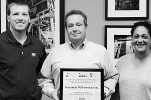 Superheat employees with an award for heat treatment