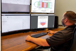 A Superheat employee monitoring heat treatment cycles from the SmartCenter
