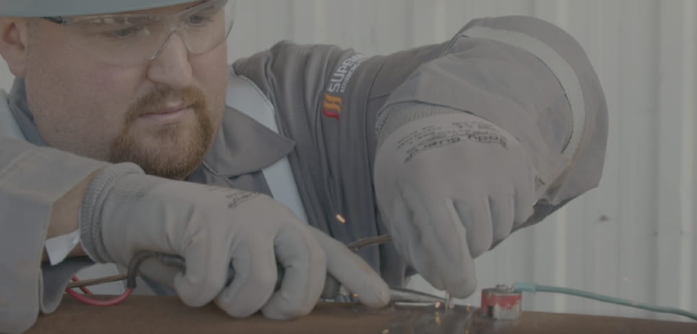 A heat treatment technician working on a wrap