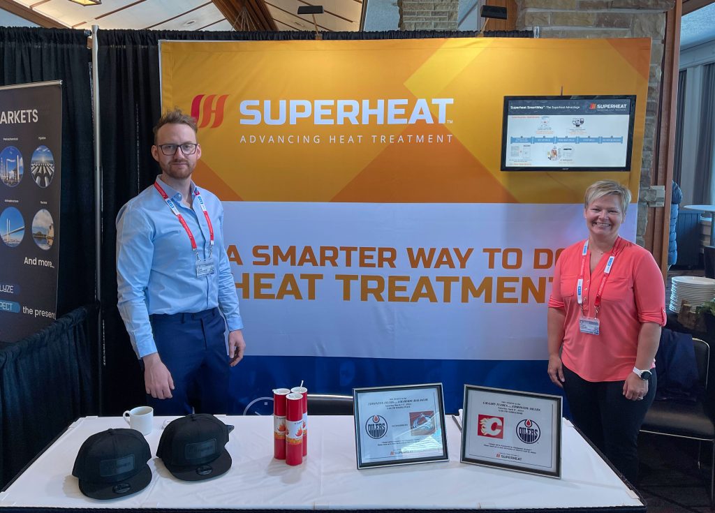 Superheat Western Canada team members Jesse and Stacy at the 2024 IPEIA Conference talking about the smarter way to do on-site heat treatment services.